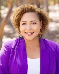 A person in purple jacket smiling

AI-generated content may be incorrect.