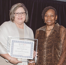 AAFCS 2017-18 President Jacqueline Holland, CFCS-HDFS, (right) presents Gayla Randel, CFCS, (left) with the Chalkley-Fenn Public Policy Visiting Scholar Award during the AAFCS 109th Annual Conference in Atlanta, Ga.