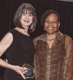 AAFCS 2017-2018 President Jacqueline Holland, CFCS-HDFS, (right) presents Dr. Deborah Sullivan, CFCS, (left) with the AAFCS Leader Award during the AAFCS 109th Annual Conference in Atlanta, Georgia.