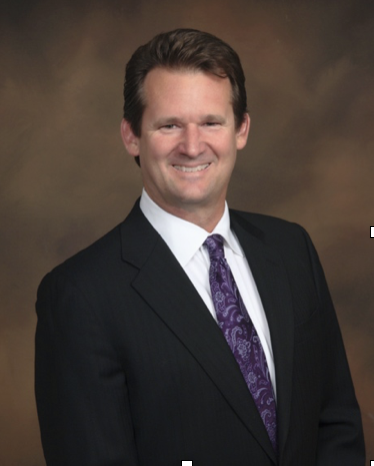 A person in a suit and tie
AI-generated content may be incorrect.