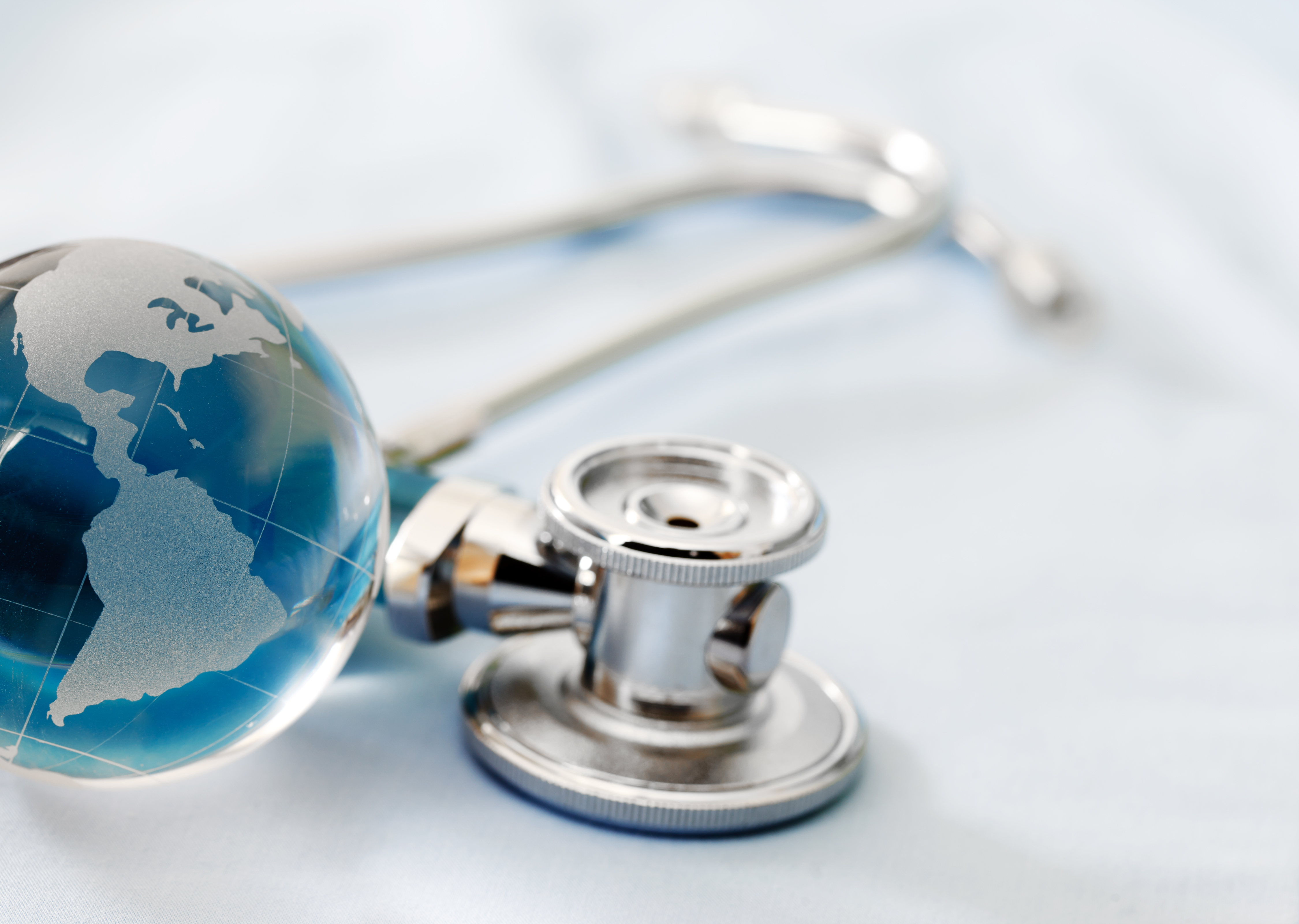 stethoscope and glass globe