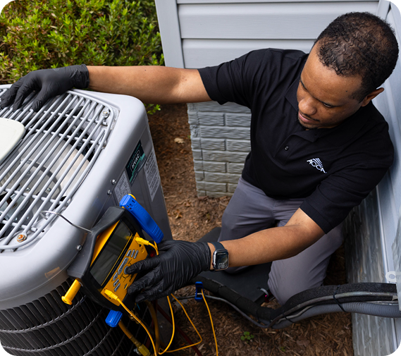 Technician working on HVAC equipment