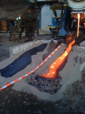 Lava flow experiments at Syracuse University using a gas-fired, tilt furnace (10 cm scale bar)