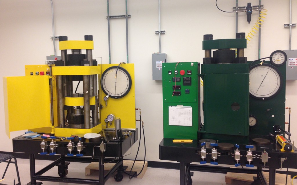 Two Kennedy-style piston cylinders in the Experimental Petrology and Igneous processes Center at Arizona State University. These presses are named Taylor (yellow) and Hunter (green); these names originated with a former owner, USGS scientist Steven Bohlen, and are named after his kids.