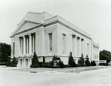 A large building with columns and a street corner

Description automatically generated with medium confidence