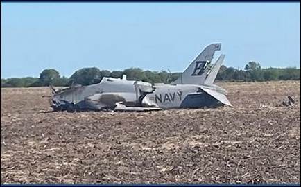 A crashed military aircraft in a field

AI-generated content may be incorrect.