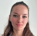 A person with brown hair and a necklace

AI-generated content may be incorrect.