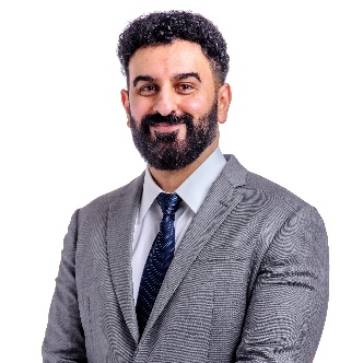 A person in a suit

AI-generated content may be incorrect.