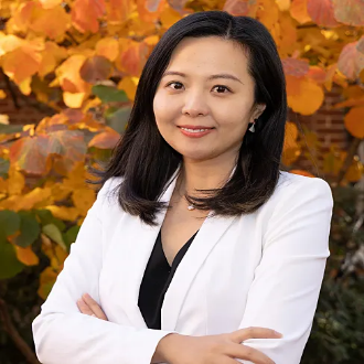 A person with black hair and white jacket

AI-generated content may be incorrect.