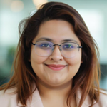 A person wearing glasses and smiling

AI-generated content may be incorrect.