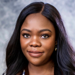 A person with long hair smiling

AI-generated content may be incorrect.