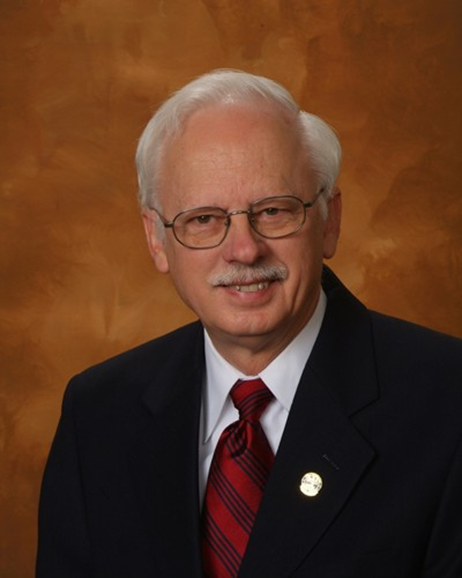 A person in a suit and tie

AI-generated content may be incorrect.