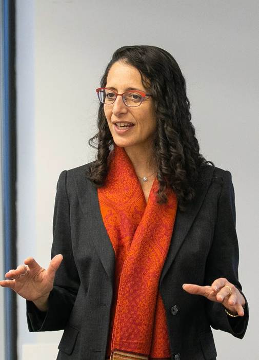 A person in a suit and glasses

AI-generated content may be incorrect.