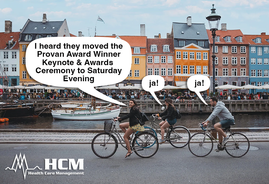 Young, ridiculously good-looking HCMers discussing the updated schedule whilst riding bikes through Nyhavn