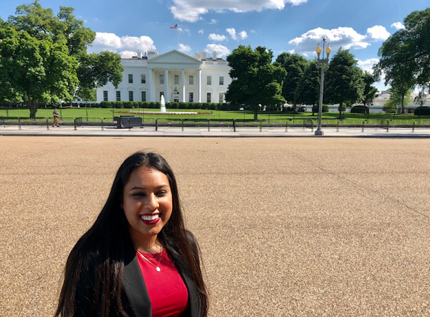 Sue Ram smiles in front of the White House