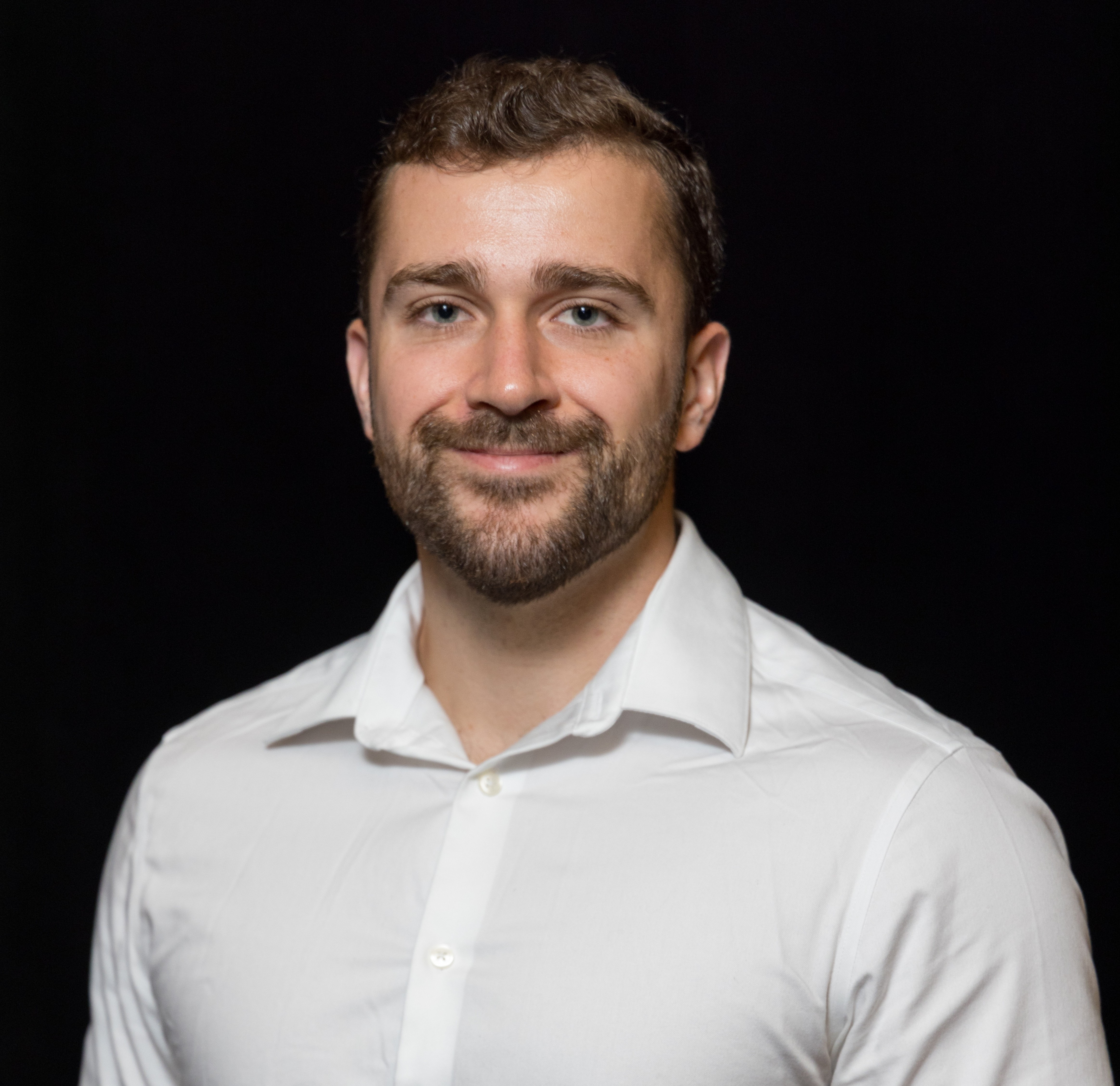 Photo of a man in a white dress shirt