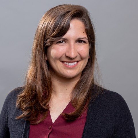 photo of a woman with brown hair smiling