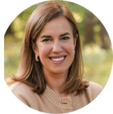 photo of a woman with brown hair smiling
