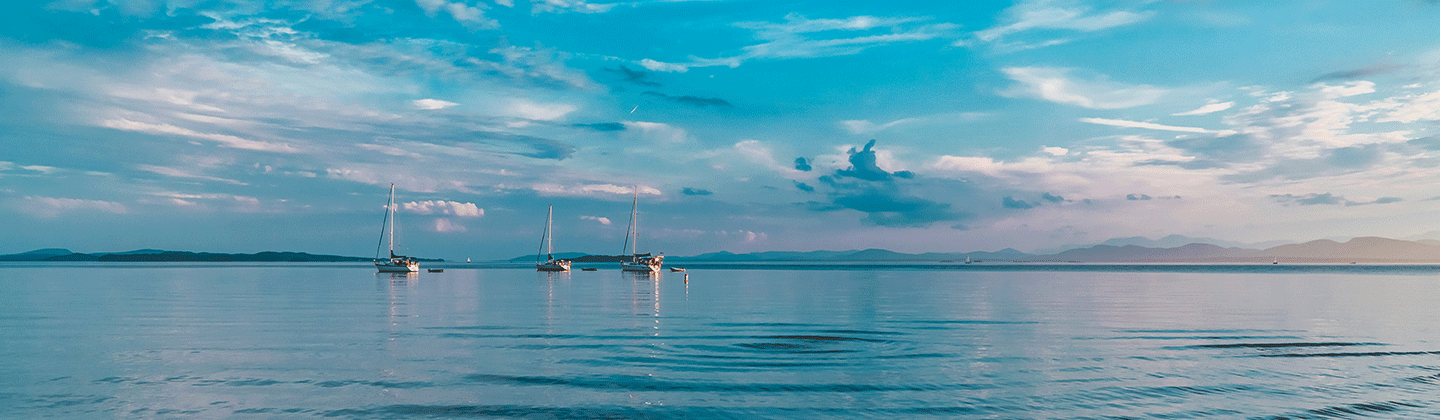 A sunset on a beach in the town of Burlington, VT Free to use under the Unsplash License by Pavel Brodsky