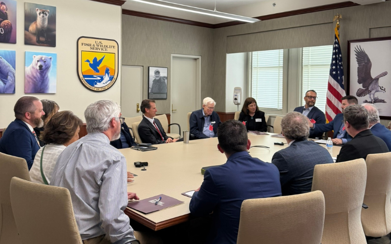 Group of meeting at a table meeting with US Fish and Wildlife Service