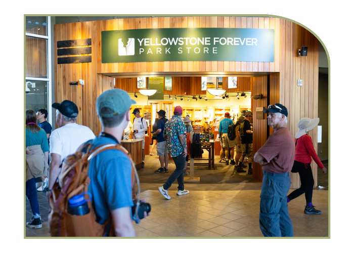 visitors walk in and out of the Yellowstone Forever National Park Store