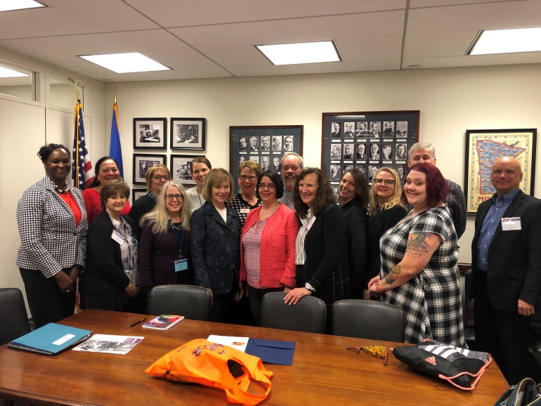 ARRM & Minnesota provider representatives posing for a photo with Sen. Tina Smith