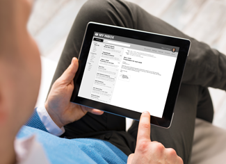 Photo of person checking email on a tablet