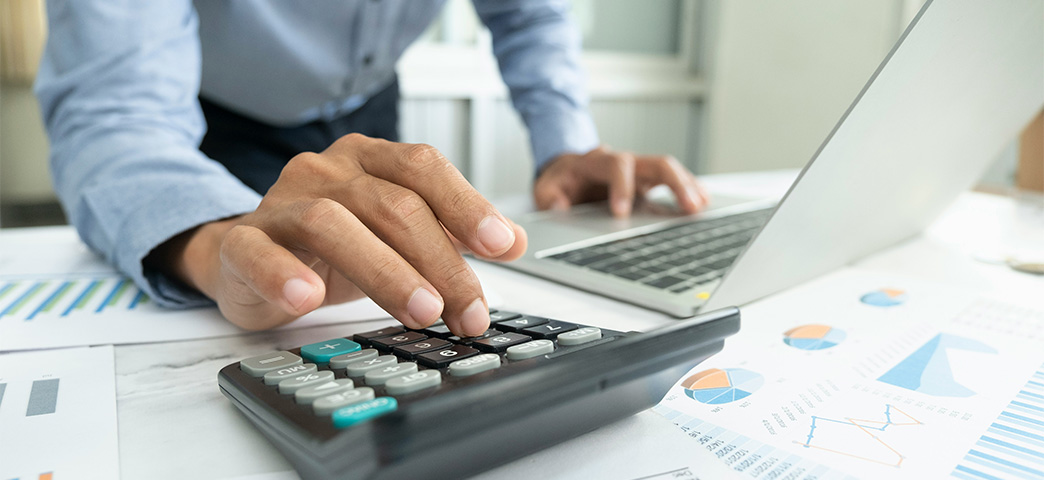 A person using a calculator.