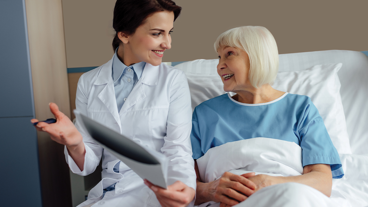 A medical professional speaking with a patient.