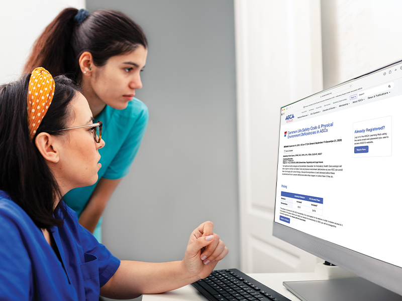 Two medical professionals viewing the webinar page on the ASCA website.