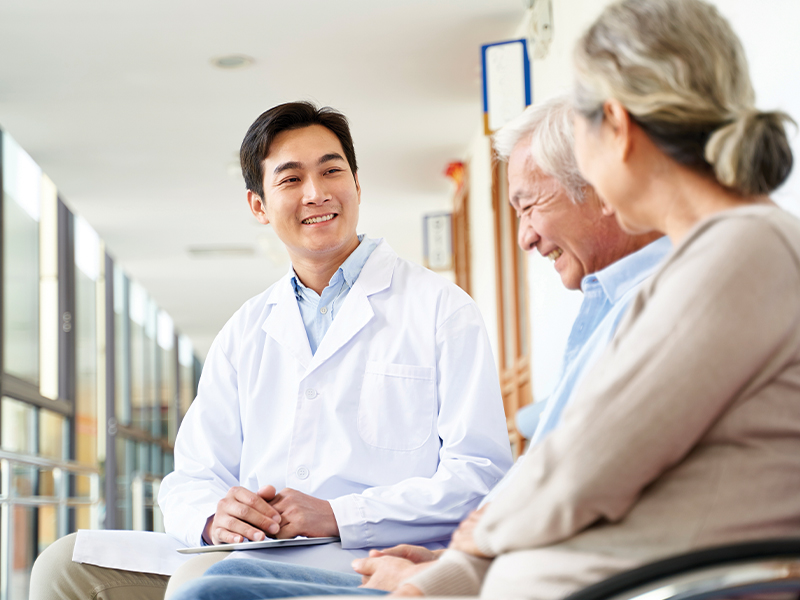 A doctor with two patients.