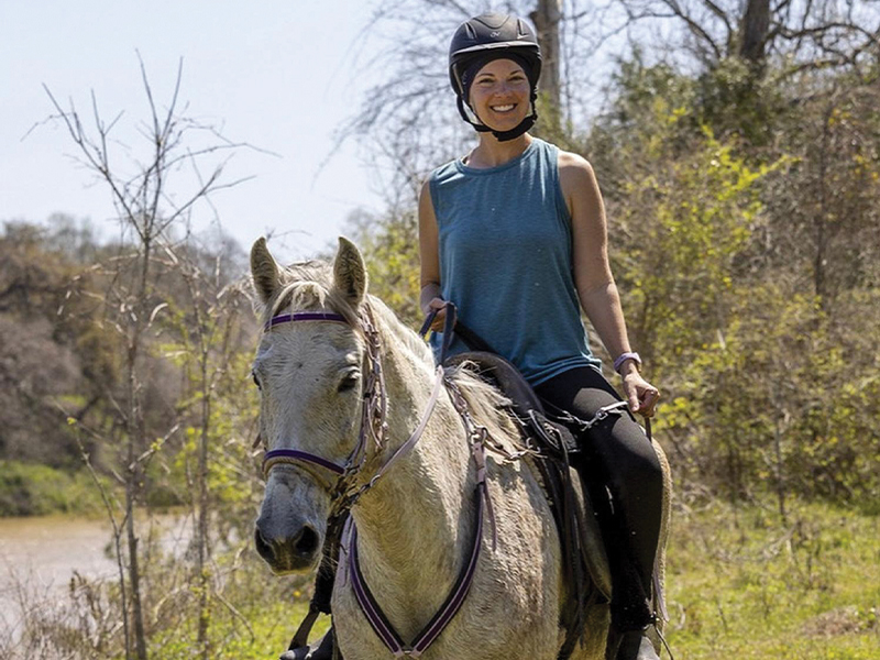 Leslie riding a horse.