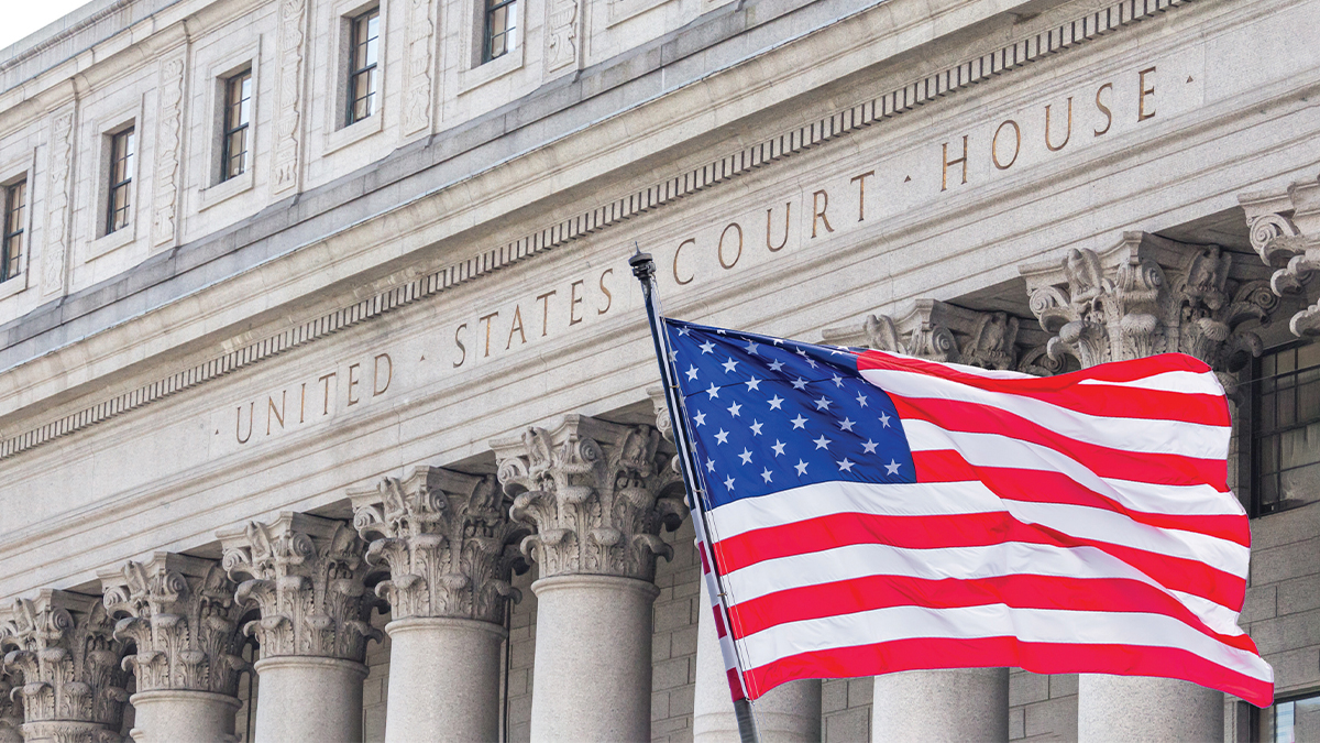 An American flag in front of the United States Court House
