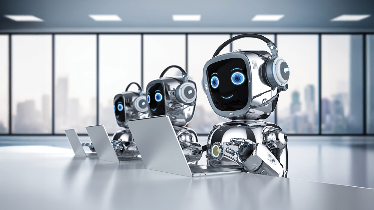 A row of smiling robots wearing headsets and working on laptops in a modern office, representing AI voice agents handling customer service tasks.A row of smiling robots wearing headsets and working on laptops in a modern office, representing AI voice agents handling customer service tasks.