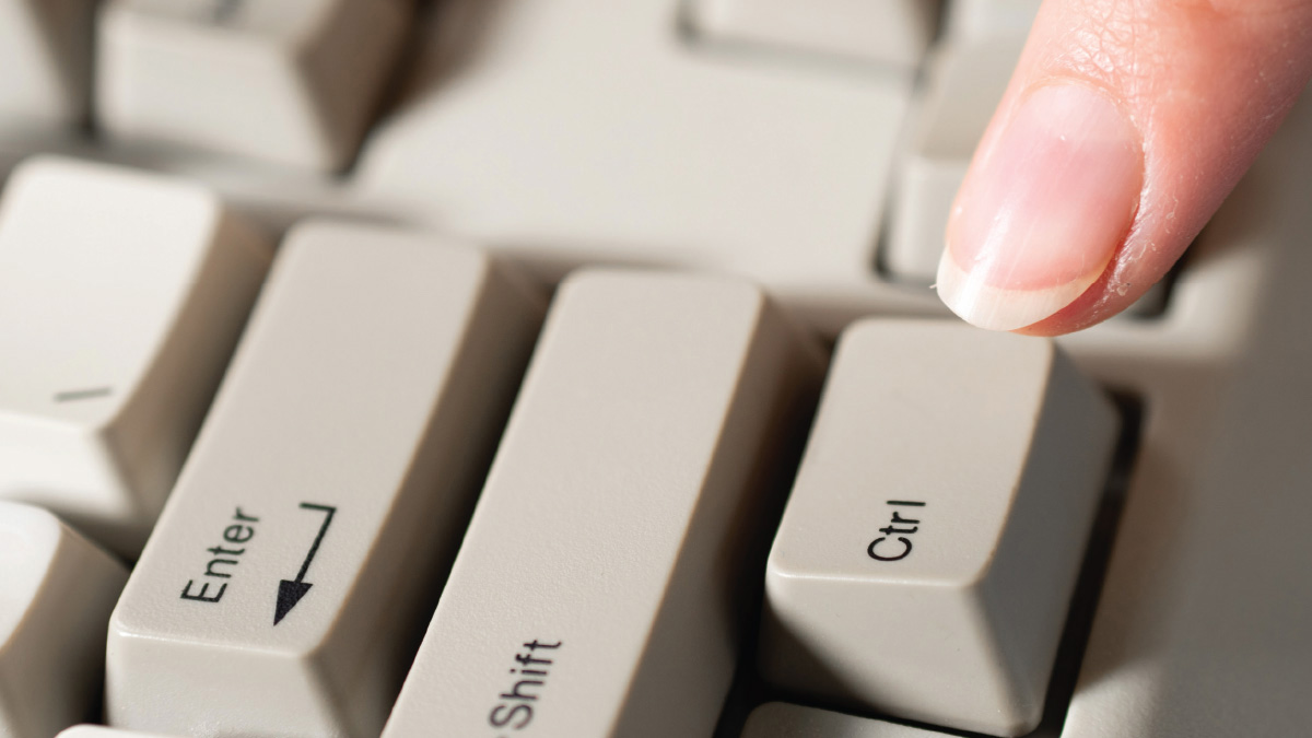 A close-up of a finger pressing the Ctrl key on a computer keyboard.A close-up of a finger pressing the Ctrl key on a computer keyboard.