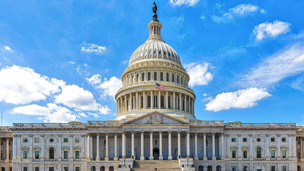 The U.S. Capitol dome in Washington, D.C., pictured against a bright blue sky with scattered clouds.