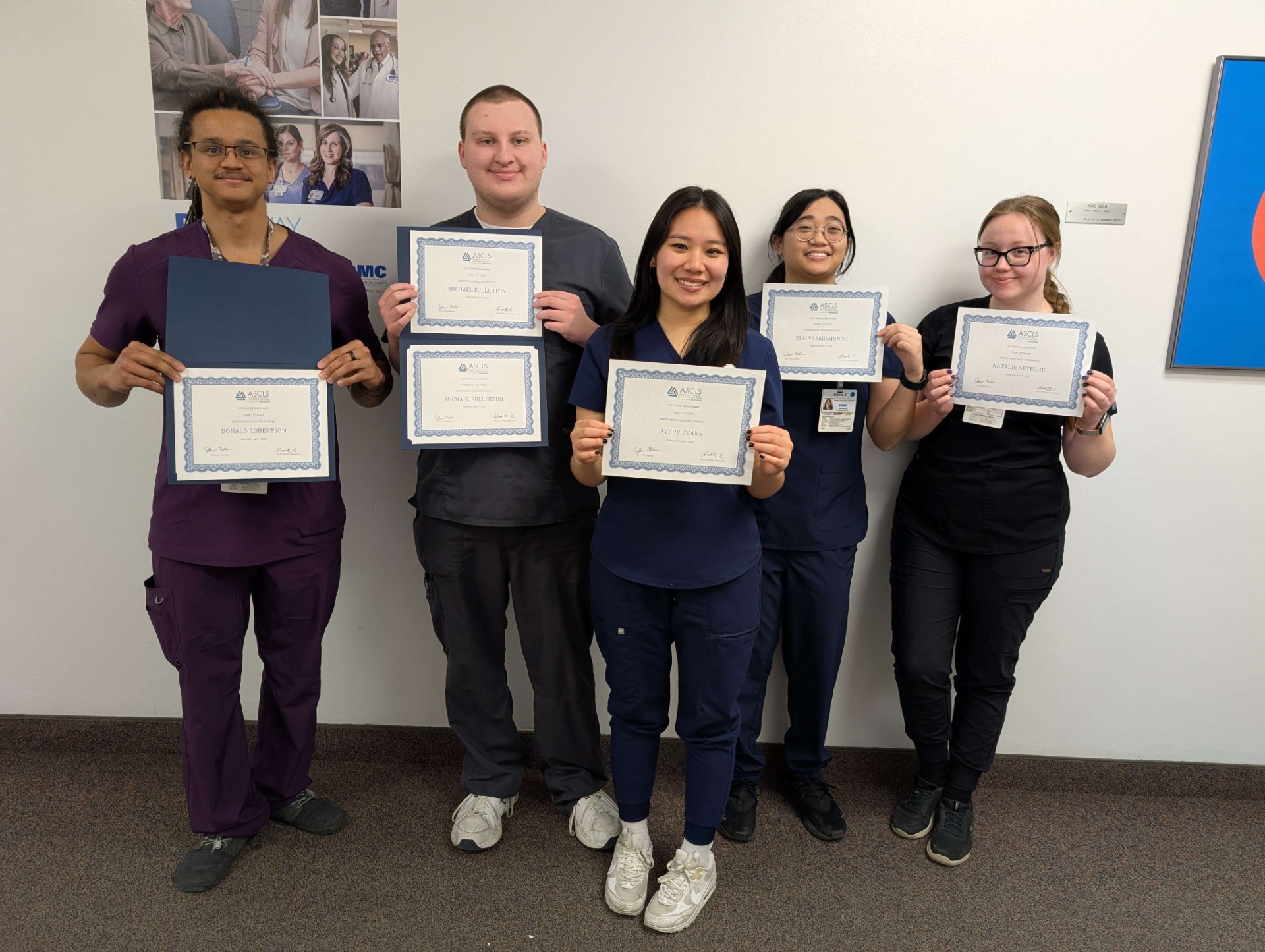 Group of students with award certificates