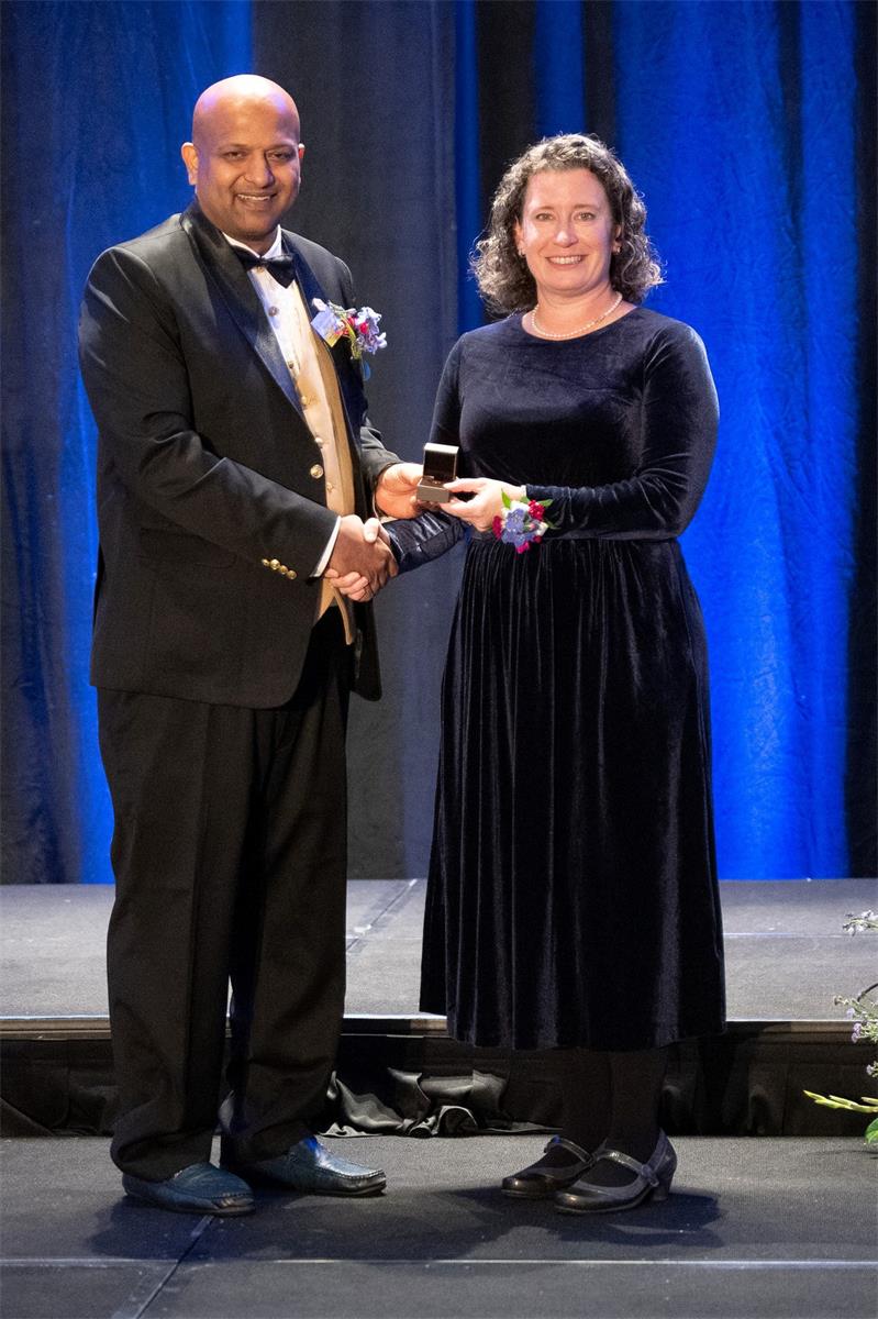 2024-2025 President Dr. Navin Manjooran passing the torch to 2025-2026 President Dr. Elizabeth Hoffman