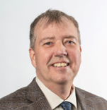 A person in a suit and tie

Description automatically generated