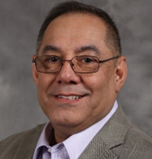 A close-up of a person wearing glasses

Description automatically generated