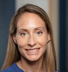 A close-up of a person smiling

AI-generated content may be incorrect.