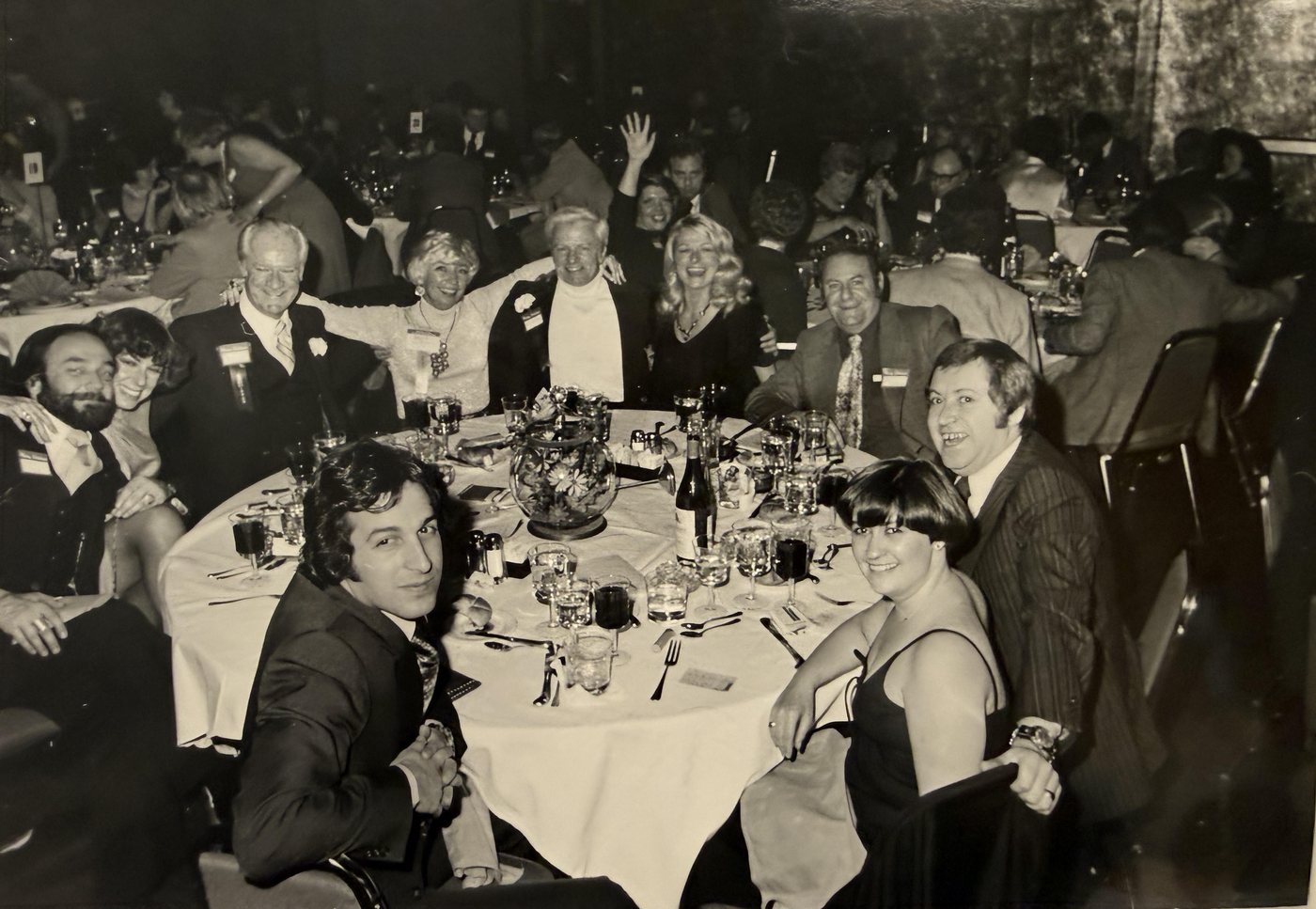 Association Forum members seated at a banquet table at a gala, from the archives