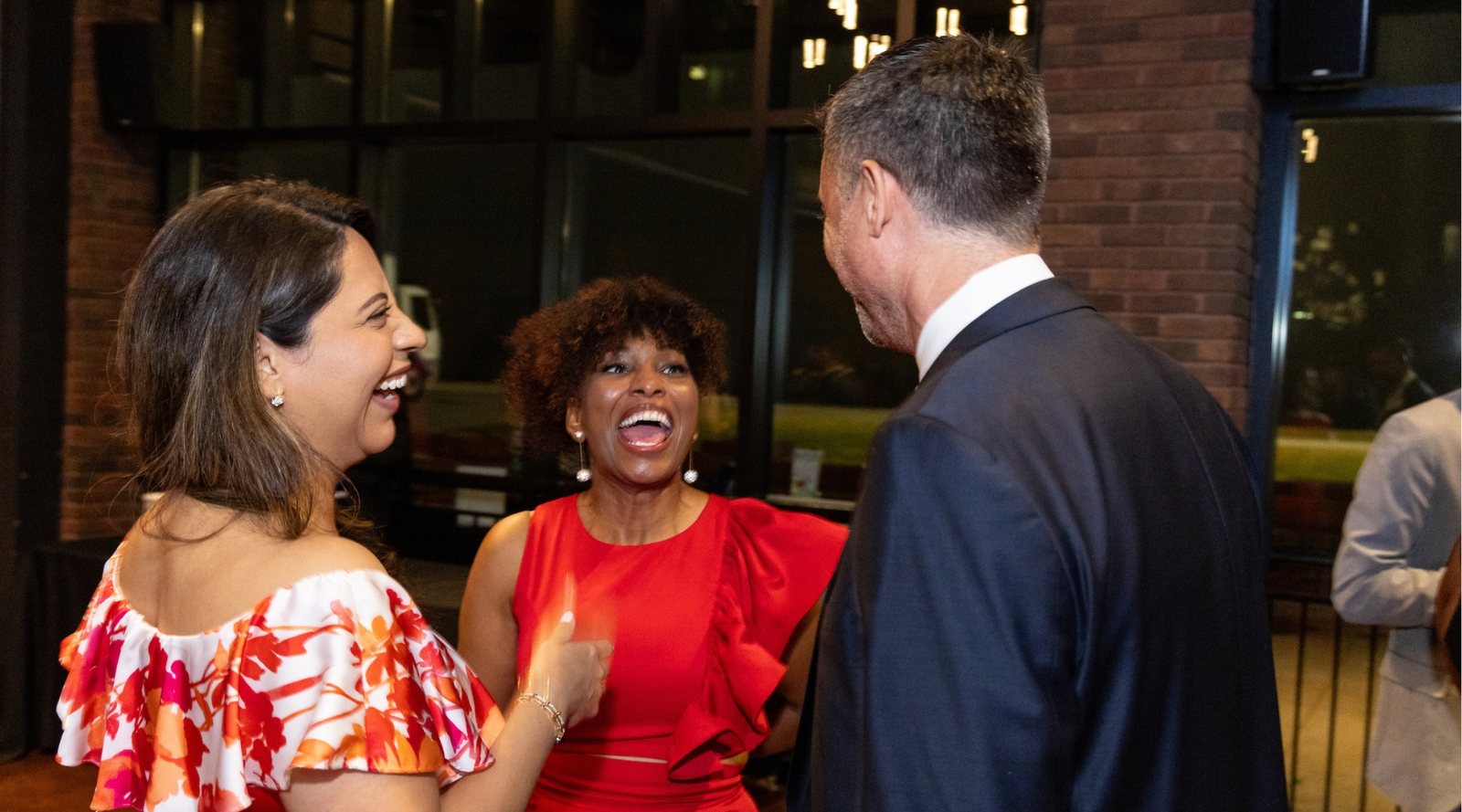 Association Forum members greeting one another at an event