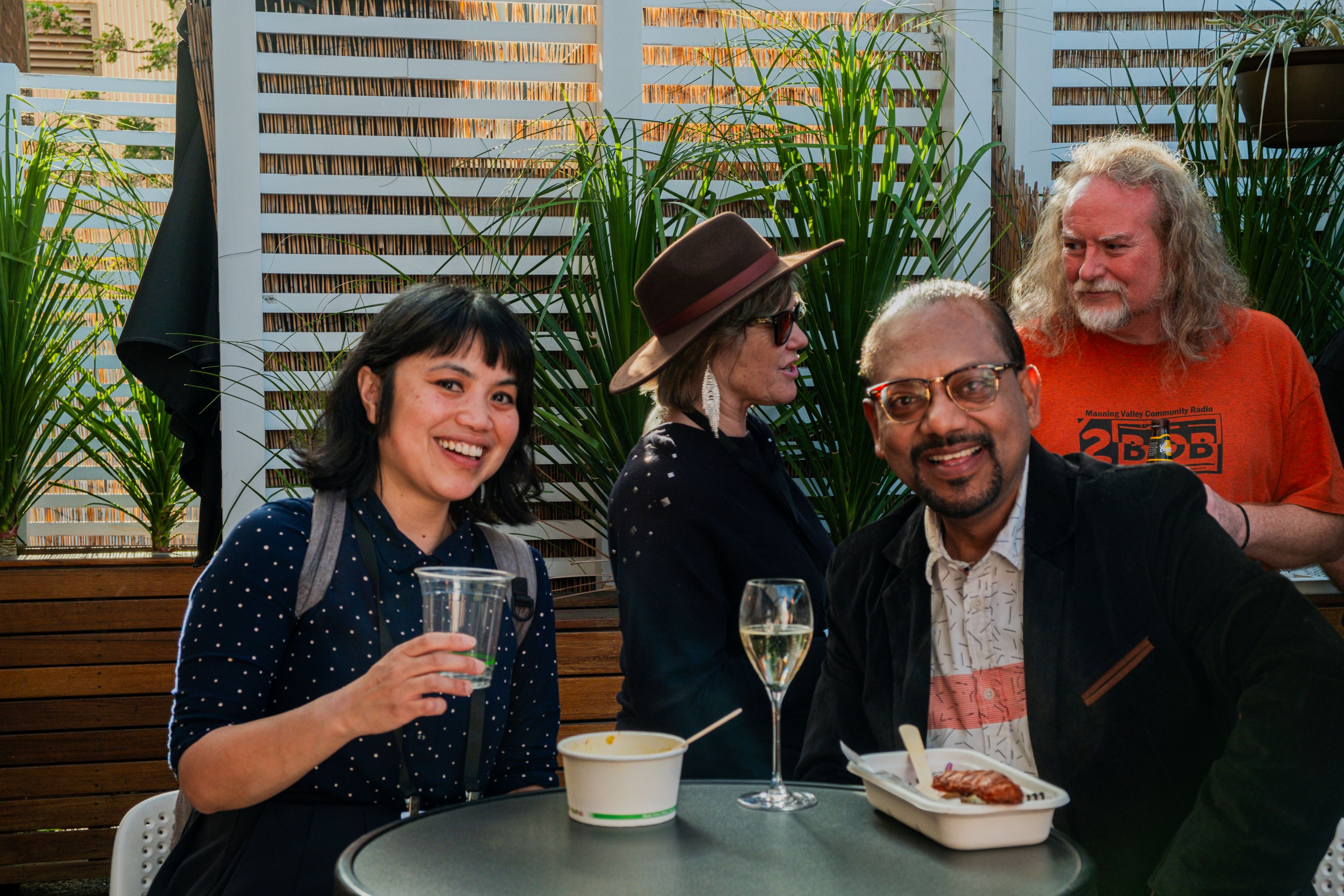 Two people at a table enjoying drinks at the CBAA Conference
