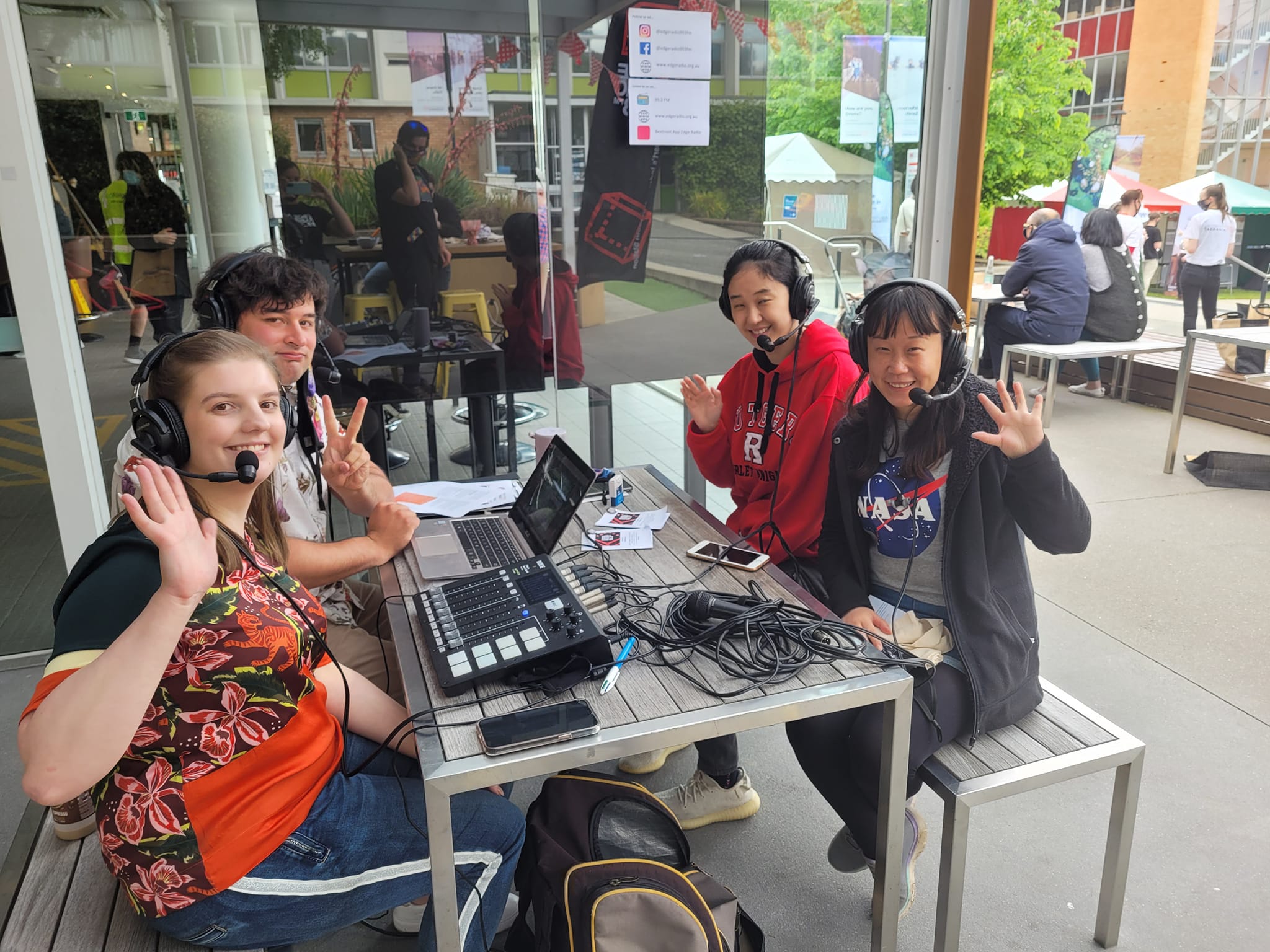 Four young people doing an outside broadcast