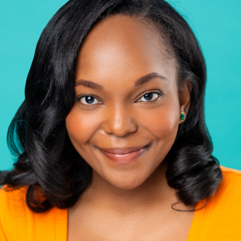 African American woman in orange top