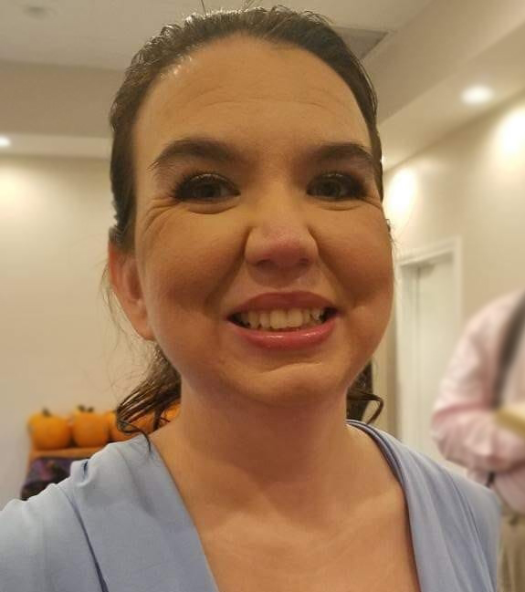 Photo of brunette woman in blue dress