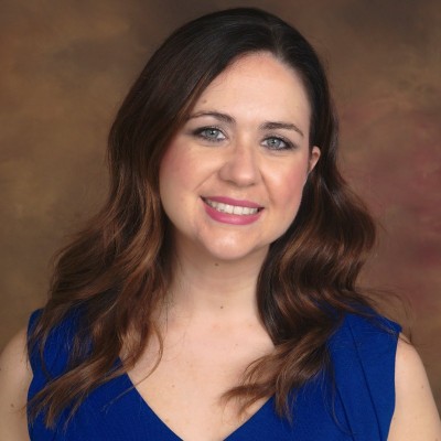 Photo of brunette woman in a blue top