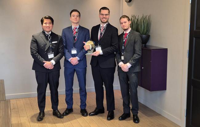 A group of men in suits standing in a room

AI-generated content may be incorrect.