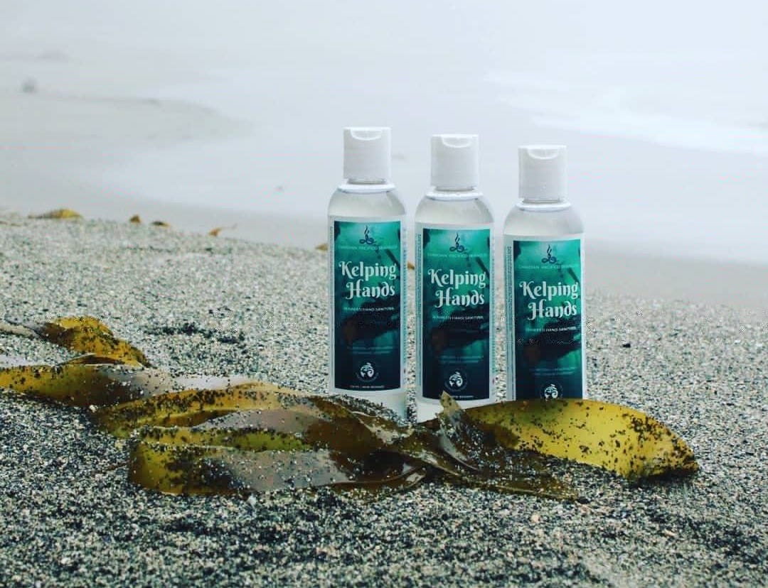 Kelping Hands bottles on the beach.